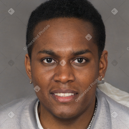 Joyful black young-adult male with short  brown hair and brown eyes