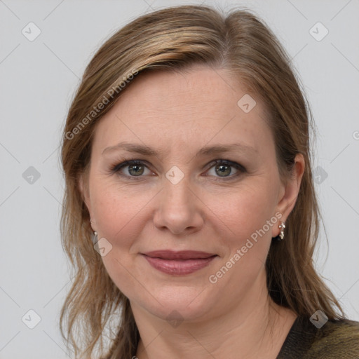 Joyful white adult female with medium  brown hair and grey eyes