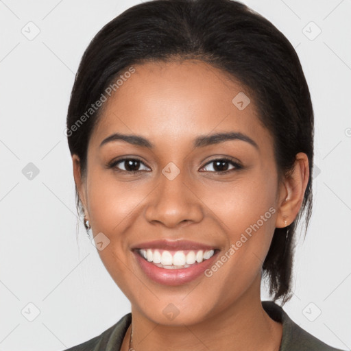 Joyful latino young-adult female with medium  brown hair and brown eyes