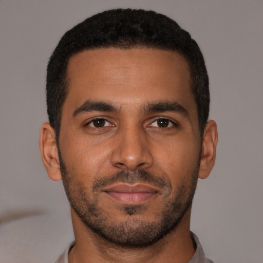 Neutral black young-adult male with short  brown hair and brown eyes