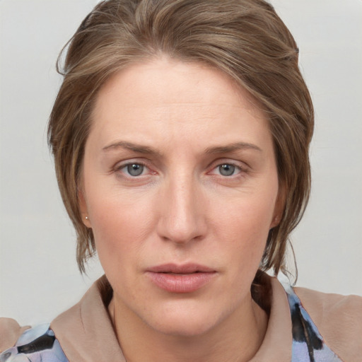 Neutral white adult female with medium  brown hair and grey eyes