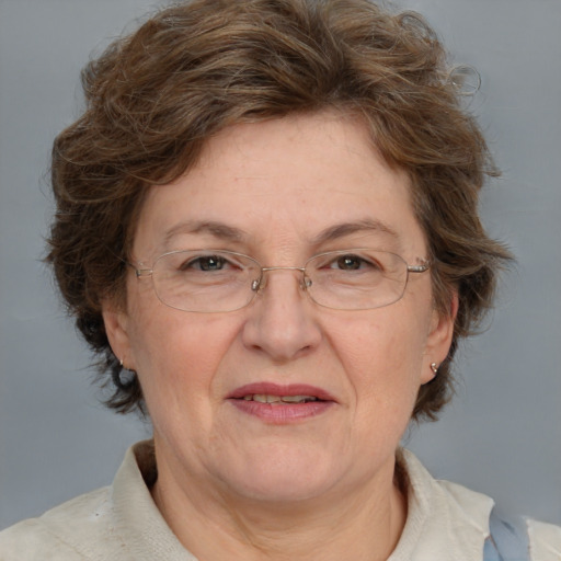 Joyful white middle-aged female with medium  brown hair and blue eyes