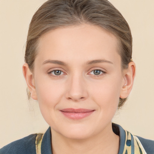 Joyful white young-adult female with medium  brown hair and blue eyes