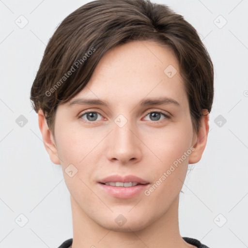 Joyful white young-adult female with short  brown hair and grey eyes