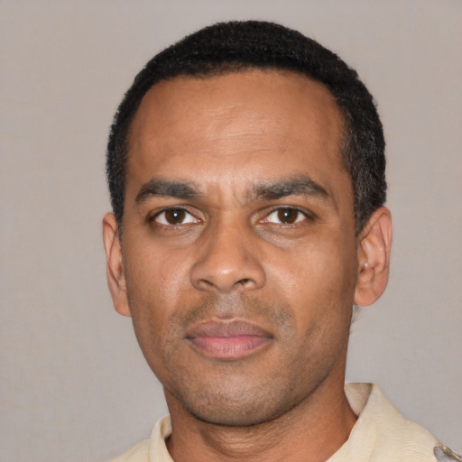 Neutral black young-adult male with short  black hair and brown eyes