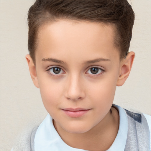 Joyful white child female with short  brown hair and brown eyes