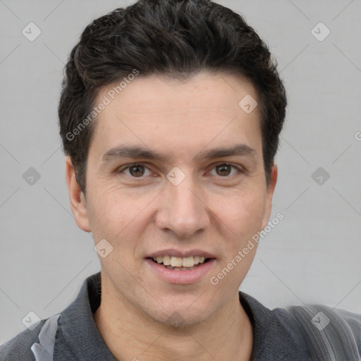 Joyful white young-adult male with short  black hair and brown eyes