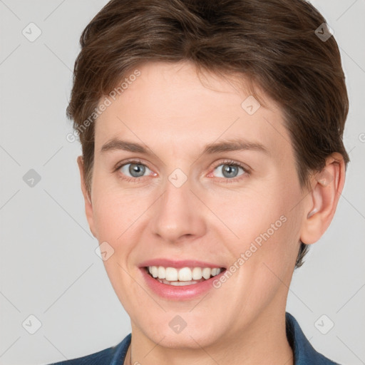 Joyful white young-adult female with short  brown hair and grey eyes