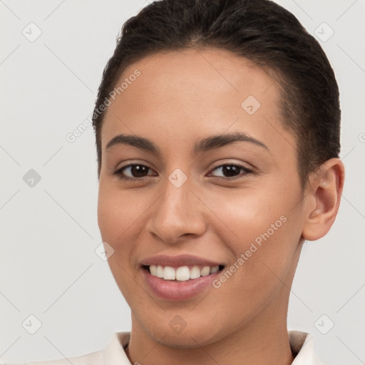 Joyful white young-adult female with short  brown hair and brown eyes