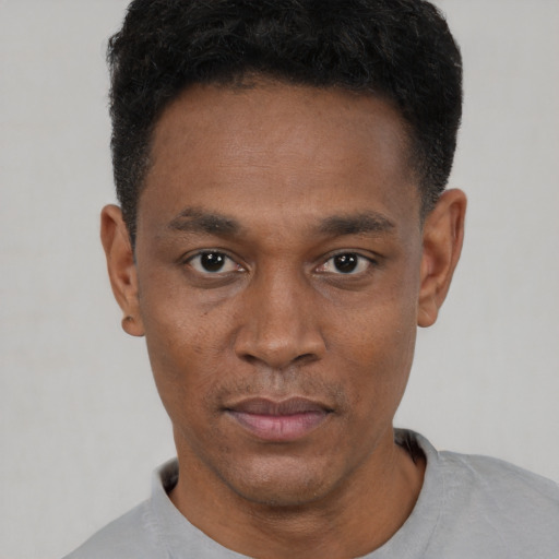 Neutral black young-adult male with short  black hair and brown eyes