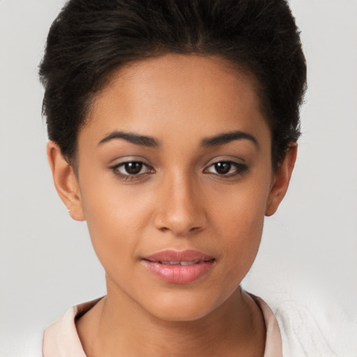 Joyful latino young-adult female with short  brown hair and brown eyes