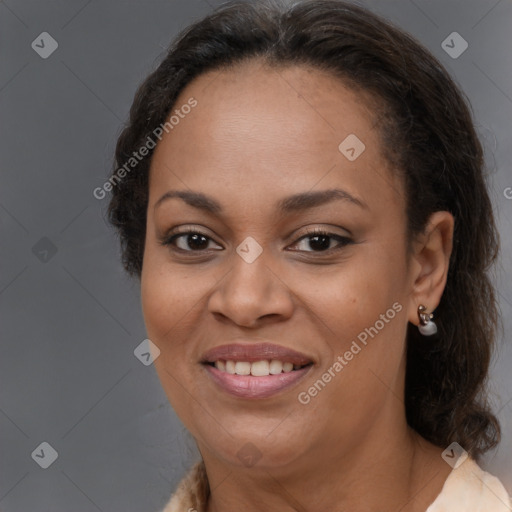 Joyful black adult female with medium  brown hair and brown eyes