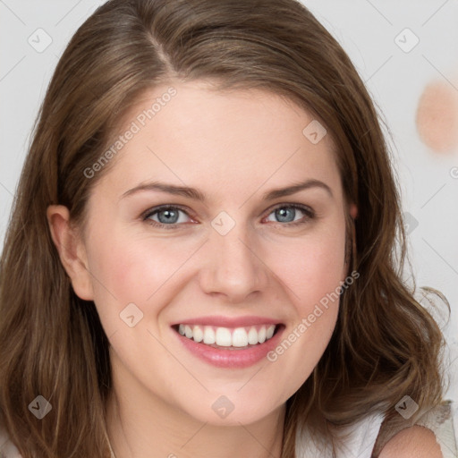 Joyful white young-adult female with long  brown hair and blue eyes