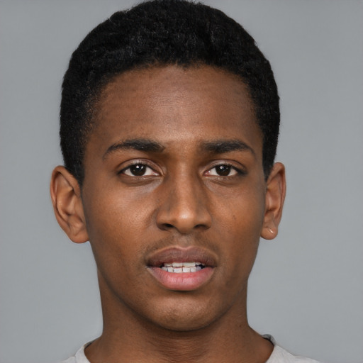 Neutral black young-adult male with short  black hair and brown eyes