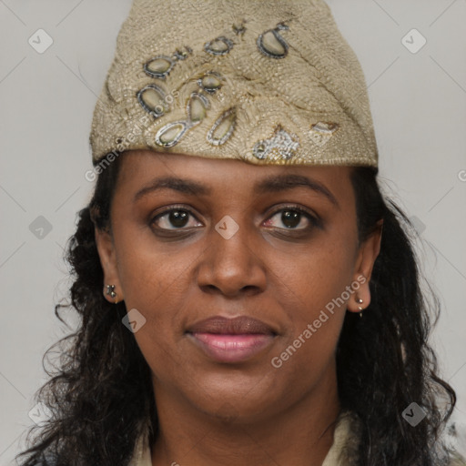 Joyful black young-adult female with long  black hair and brown eyes