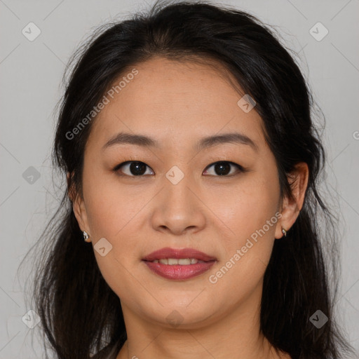 Joyful asian young-adult female with long  brown hair and brown eyes