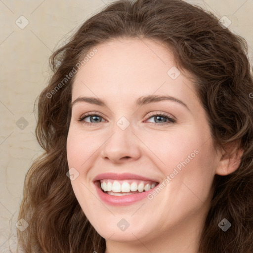 Joyful white young-adult female with long  brown hair and green eyes