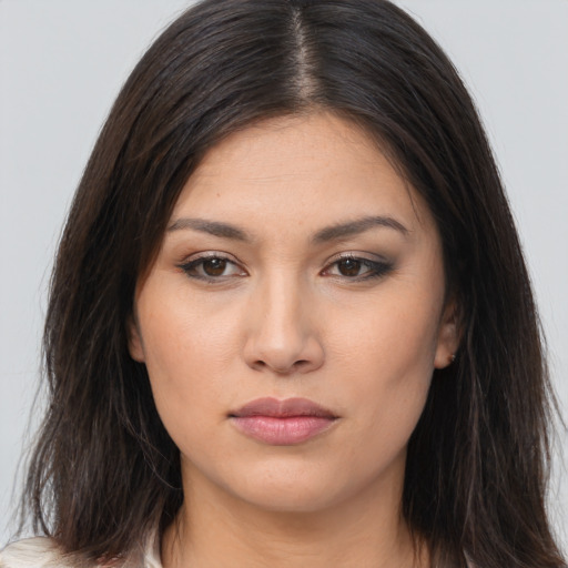 Joyful white young-adult female with long  brown hair and brown eyes