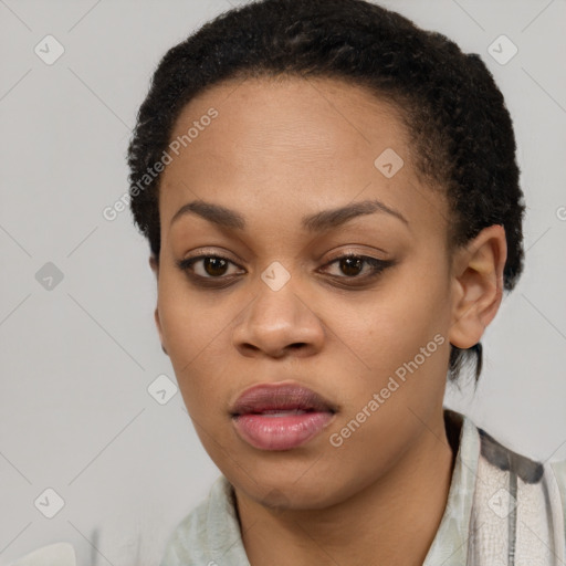 Joyful black young-adult female with short  black hair and brown eyes