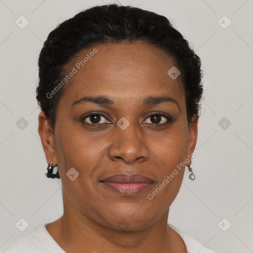 Joyful black adult female with short  brown hair and brown eyes