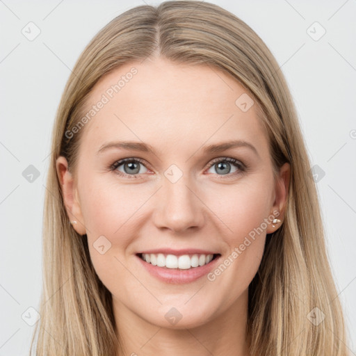 Joyful white young-adult female with long  brown hair and blue eyes