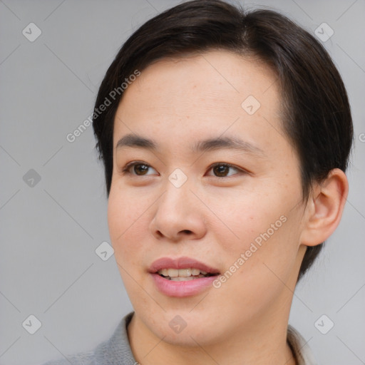 Joyful asian young-adult female with medium  brown hair and brown eyes