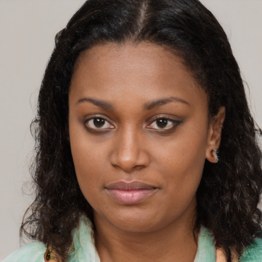 Neutral black young-adult female with medium  brown hair and brown eyes