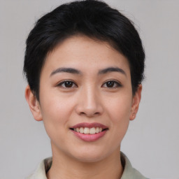 Joyful asian young-adult female with short  brown hair and brown eyes