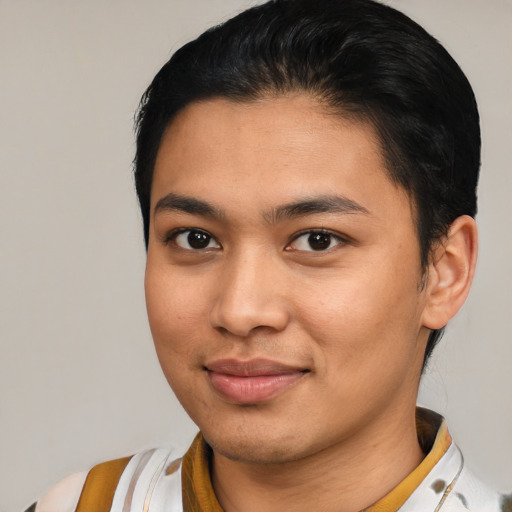 Joyful latino young-adult male with medium  brown hair and brown eyes