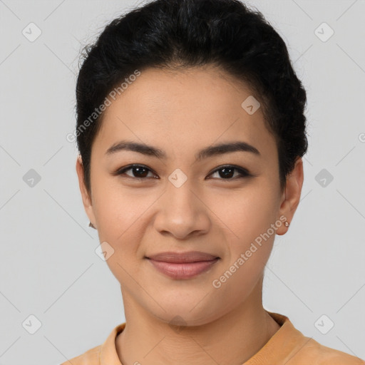 Joyful latino young-adult female with short  black hair and brown eyes