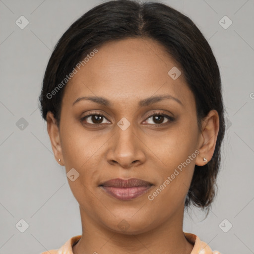 Joyful latino young-adult female with medium  brown hair and brown eyes