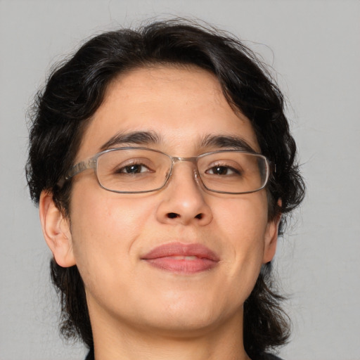 Joyful white adult male with medium  brown hair and brown eyes