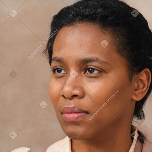 Neutral black young-adult female with short  black hair and brown eyes