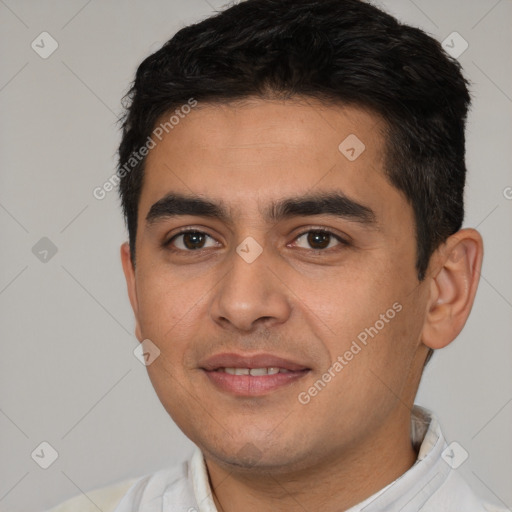 Joyful white young-adult male with short  black hair and brown eyes