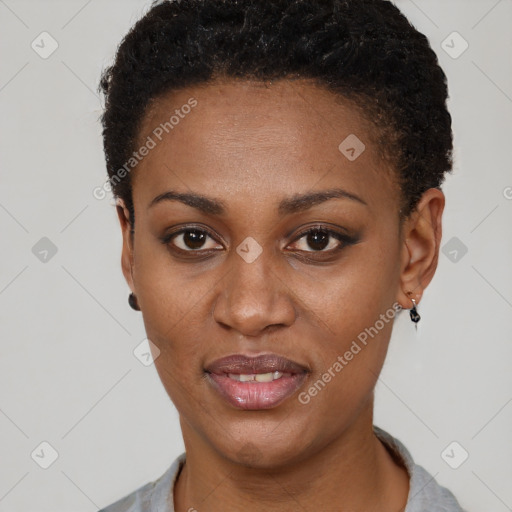 Joyful black young-adult female with short  brown hair and brown eyes