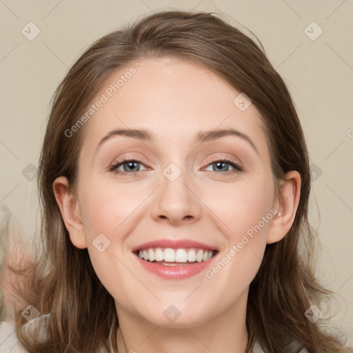 Joyful white young-adult female with medium  brown hair and blue eyes