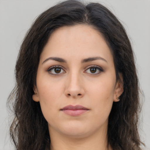 Neutral latino young-adult female with long  brown hair and brown eyes