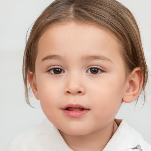 Joyful white child female with medium  brown hair and brown eyes