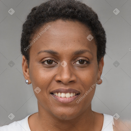 Joyful black young-adult female with short  brown hair and brown eyes