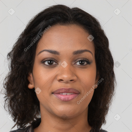 Joyful black young-adult female with long  brown hair and brown eyes