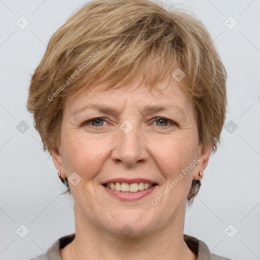 Joyful white adult female with short  brown hair and grey eyes