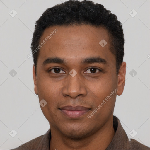 Joyful black young-adult male with short  black hair and brown eyes