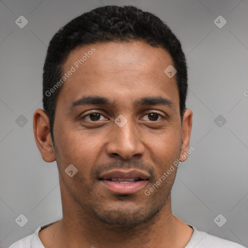 Joyful black young-adult male with short  black hair and brown eyes