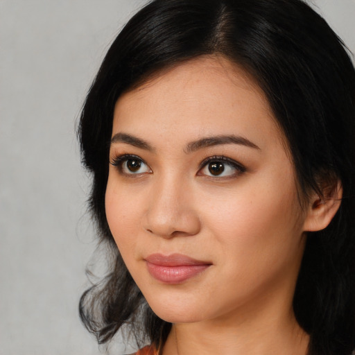 Neutral latino young-adult female with medium  black hair and brown eyes
