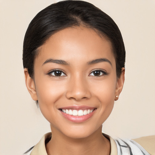 Joyful latino young-adult female with short  brown hair and brown eyes