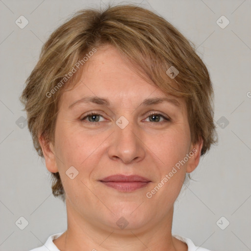 Joyful white adult female with short  brown hair and grey eyes