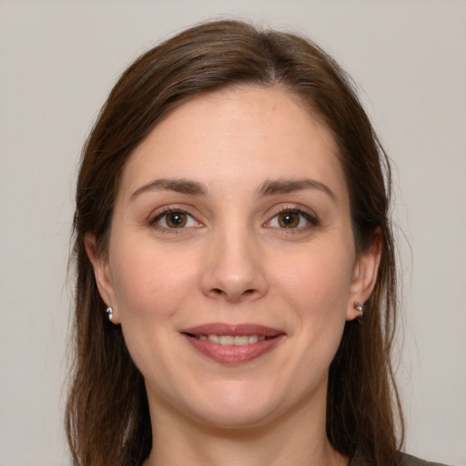 Joyful white young-adult female with long  brown hair and grey eyes