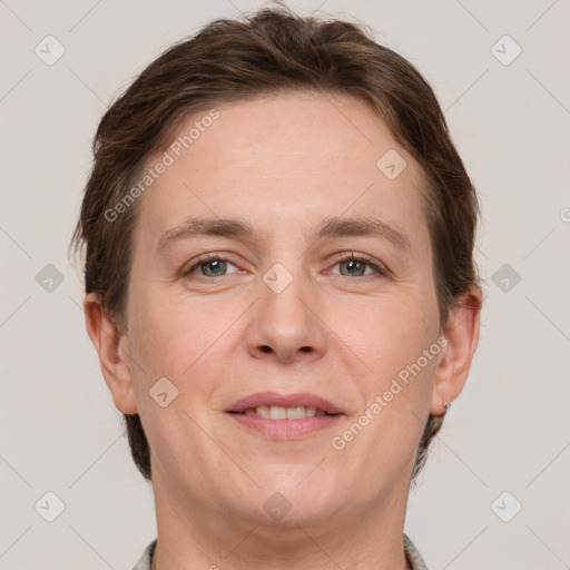 Joyful white adult female with short  brown hair and grey eyes