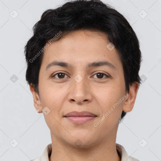 Joyful latino young-adult male with short  brown hair and brown eyes