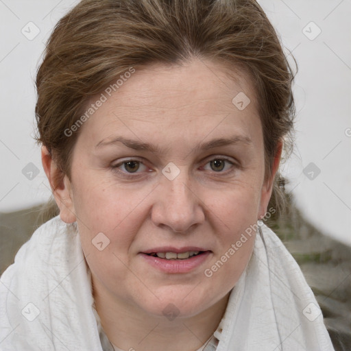 Joyful white adult female with short  brown hair and grey eyes